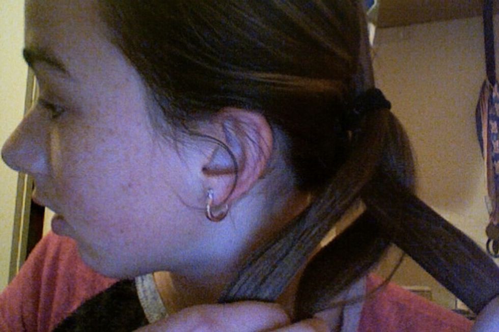 Bring the other strand side over/under the middle. Keep repeating steps 4 & 5 all the way down to the end of your pony tail and tie with hair tie.