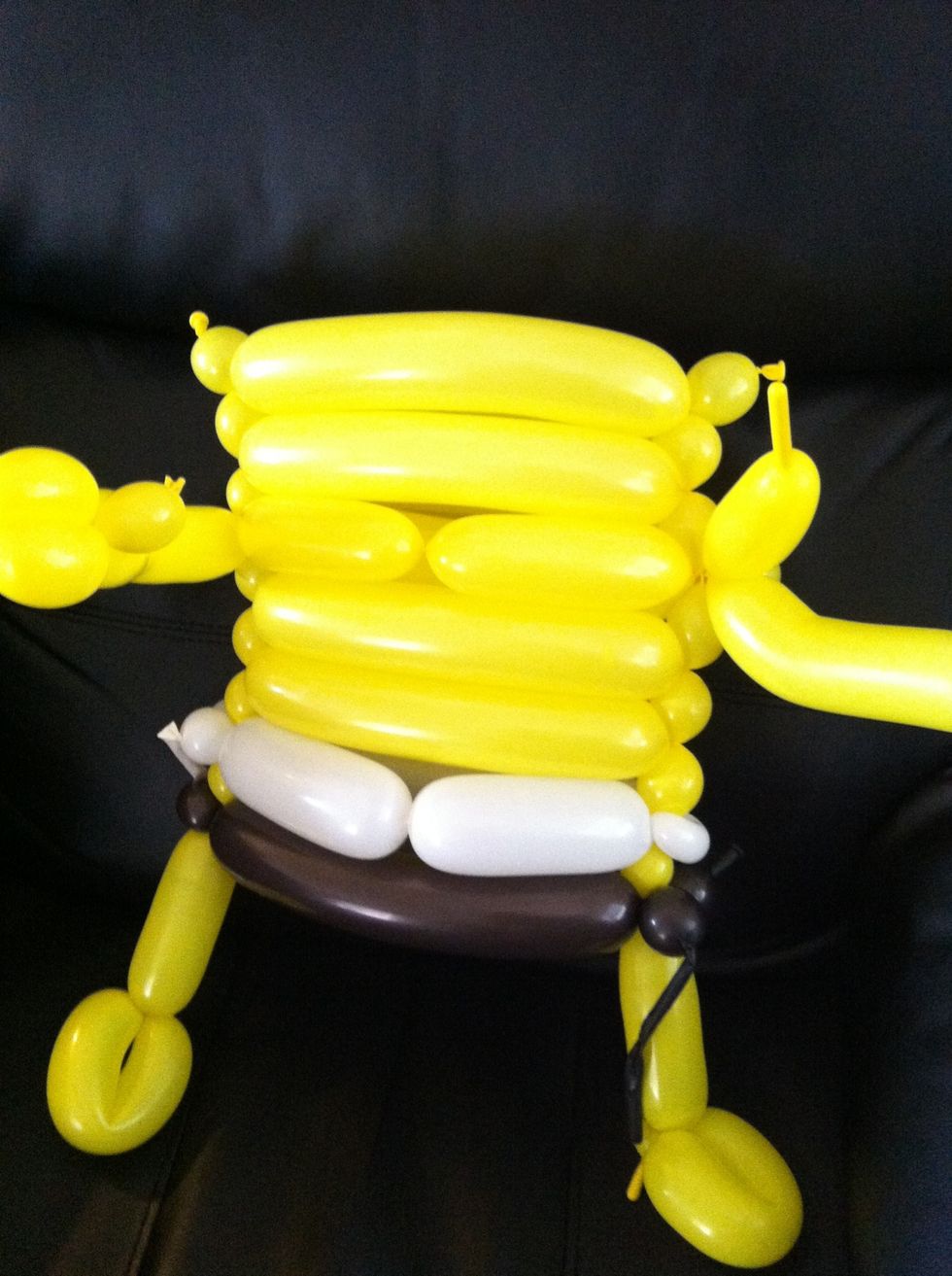 Bring the rest of the balloon around the back and twist into extra bubbles on other side. Make dog head for hand (bubble loop chain)