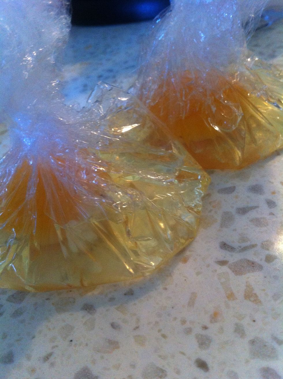 Bring the sides of the wrap into the middle and twist them into the above shape