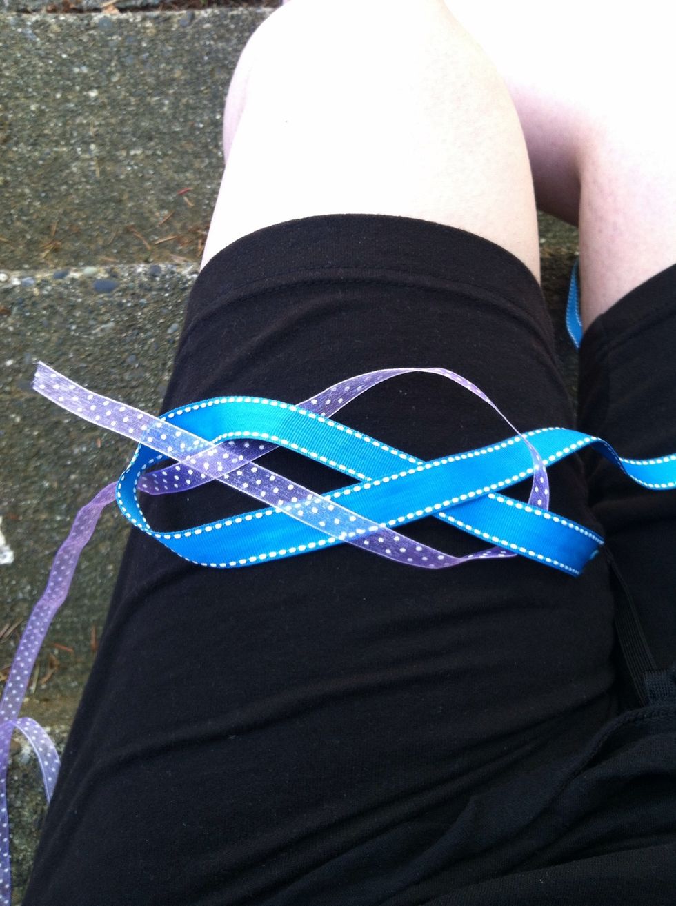 Bring the tail of the second piece all the way around (to make it's own loop) but thread the tail OVER blue, then UNDER purple, then OVER blue of the first rope loop.