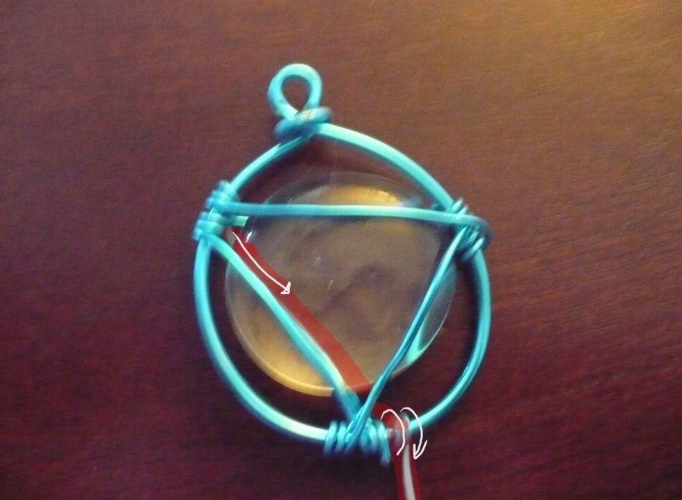 Bring the thin wire behind and down to bottom and wrap twice.