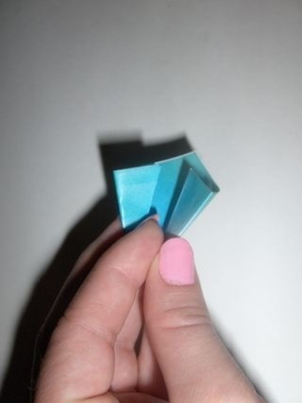Bring the two edges together as shown...