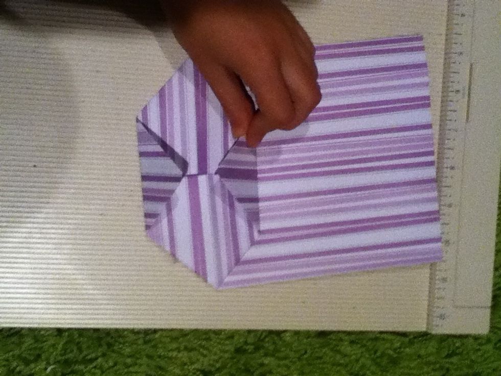 Bring the two pointy edges to the middle.