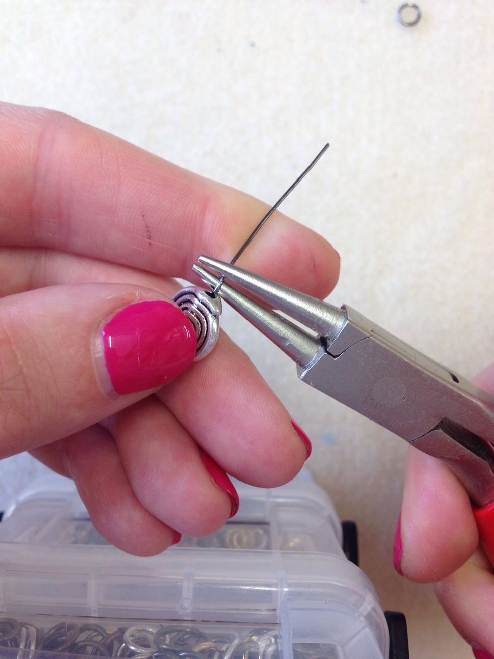 Bring the wire back over the top and towards the front of the plier