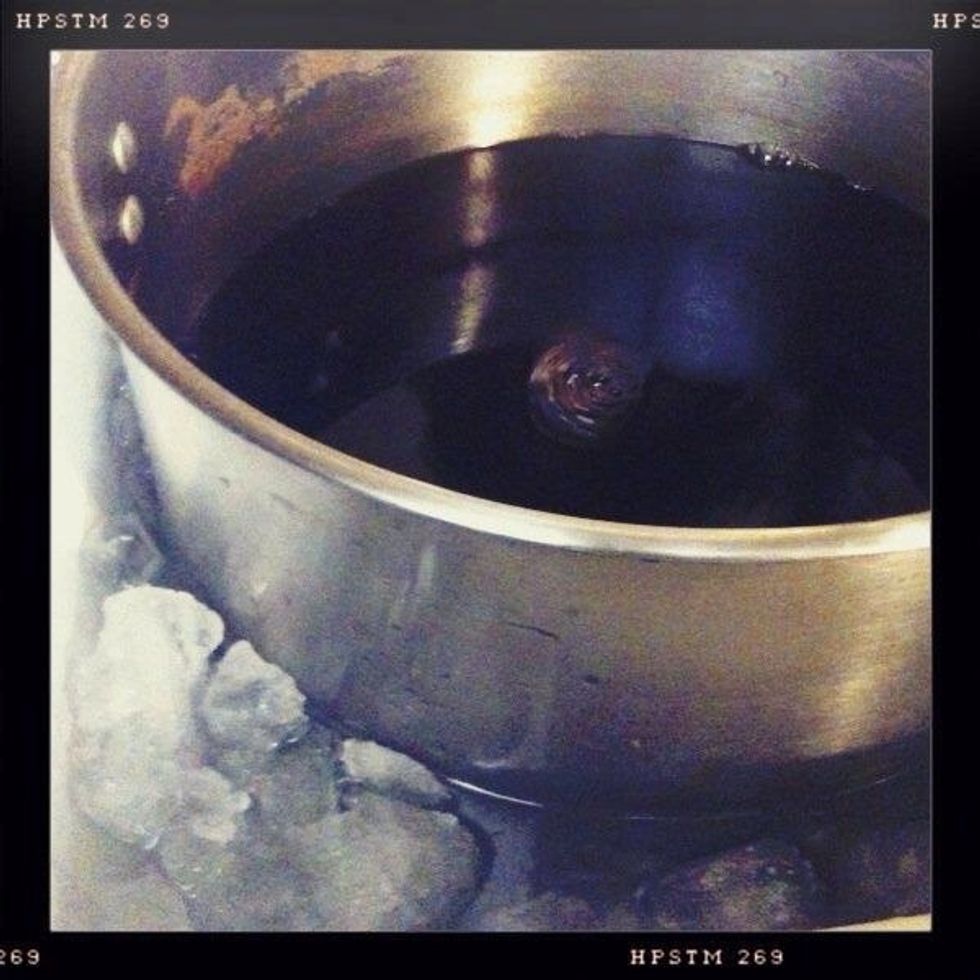 Bring the wort to 100 degrees as quickly as possible by putting the kettle in an ice bath in the sink.