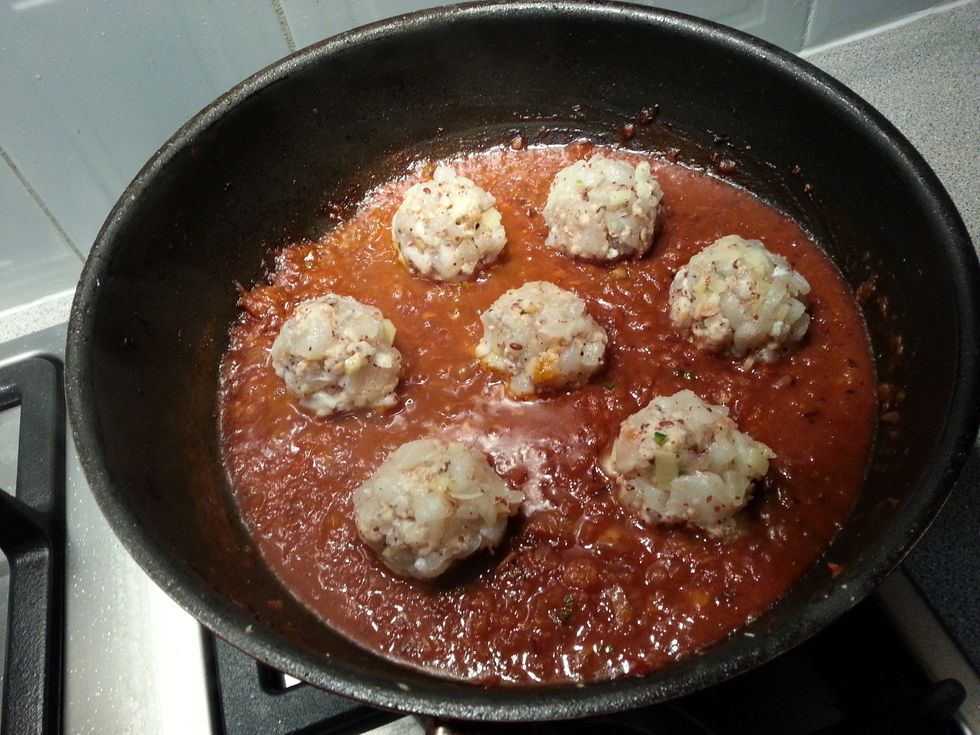 Bring to a boil, then reduce to a simmer. Place the fish balls in the sauce.