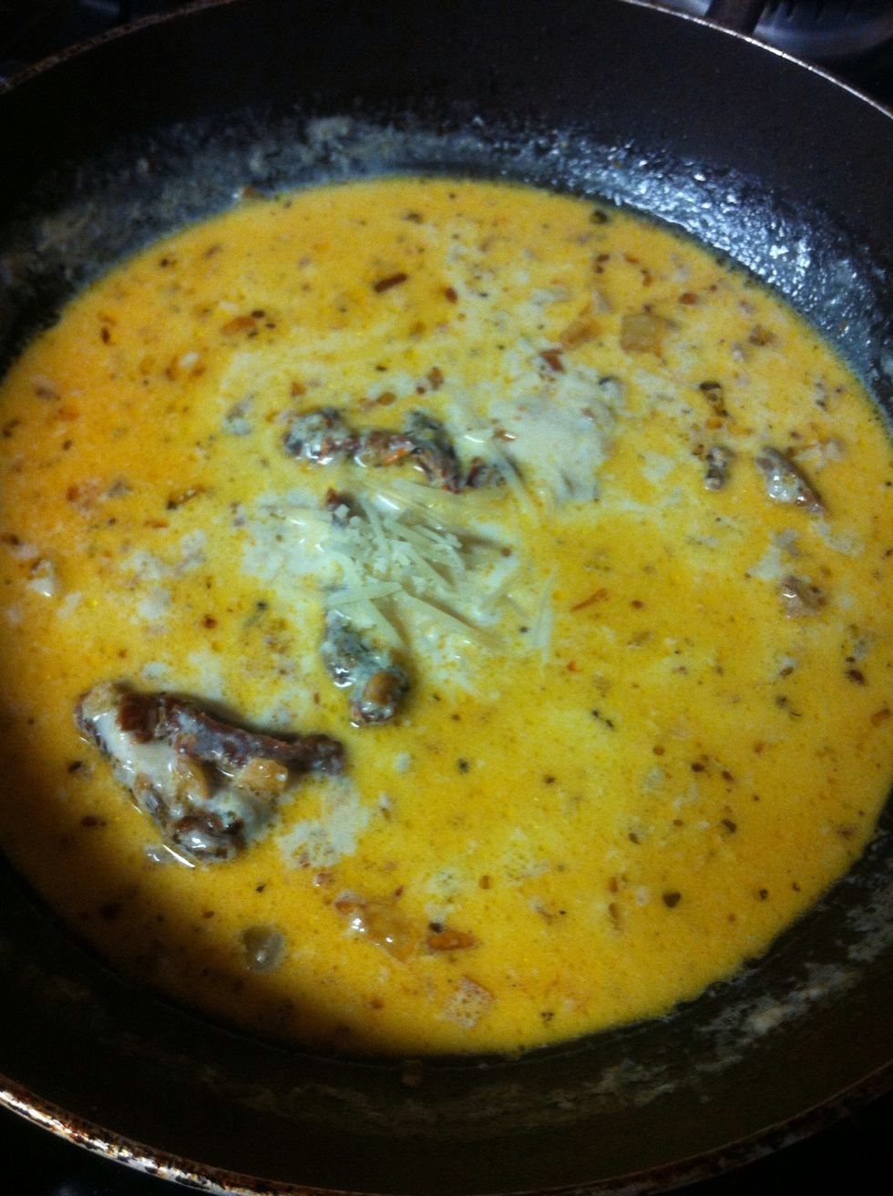 Bring to a light boil but keep stirring so the milk doesn't burn. Then add Parmesan cheese