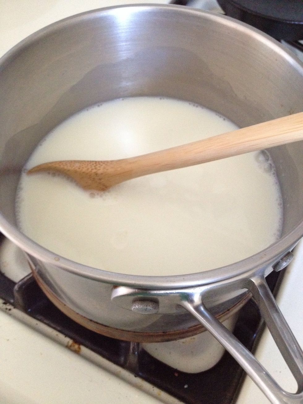 Bring to a simmer over medium heat , stirring occasionally, to dissolve the sugar.