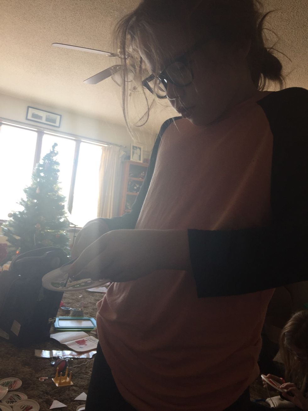 Bring to your mom when you have a full enough tree made from yarn so she can show you how to tie the end of the yarn to the back so it will stay on the back and not slip back through the hole.