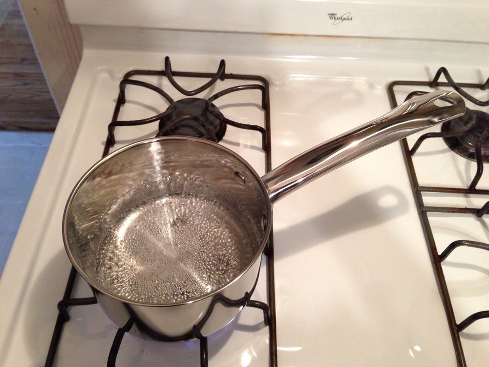 Bring water to a gentle simmer in the bottom of a double boiler.