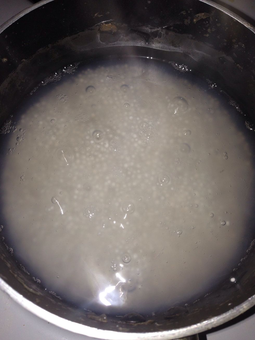 Bring water to boil. Add sago an dimmer for 10 min, cover the pot with a lid and let the sago continue to cook on its own (around 10 min). Until all sago turn translucent. Set aside.