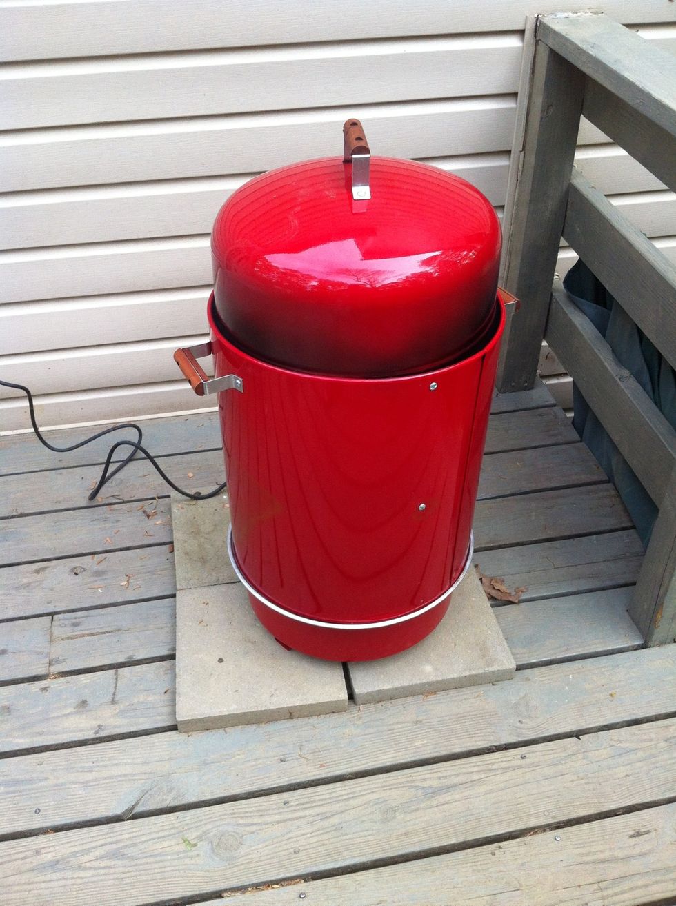 Brinkman Gourmet Electric Smoker. Fill water pan with 2 liters of water & for easier cleanup wrap bottom rack, the one that ribs will go on in, with foil.