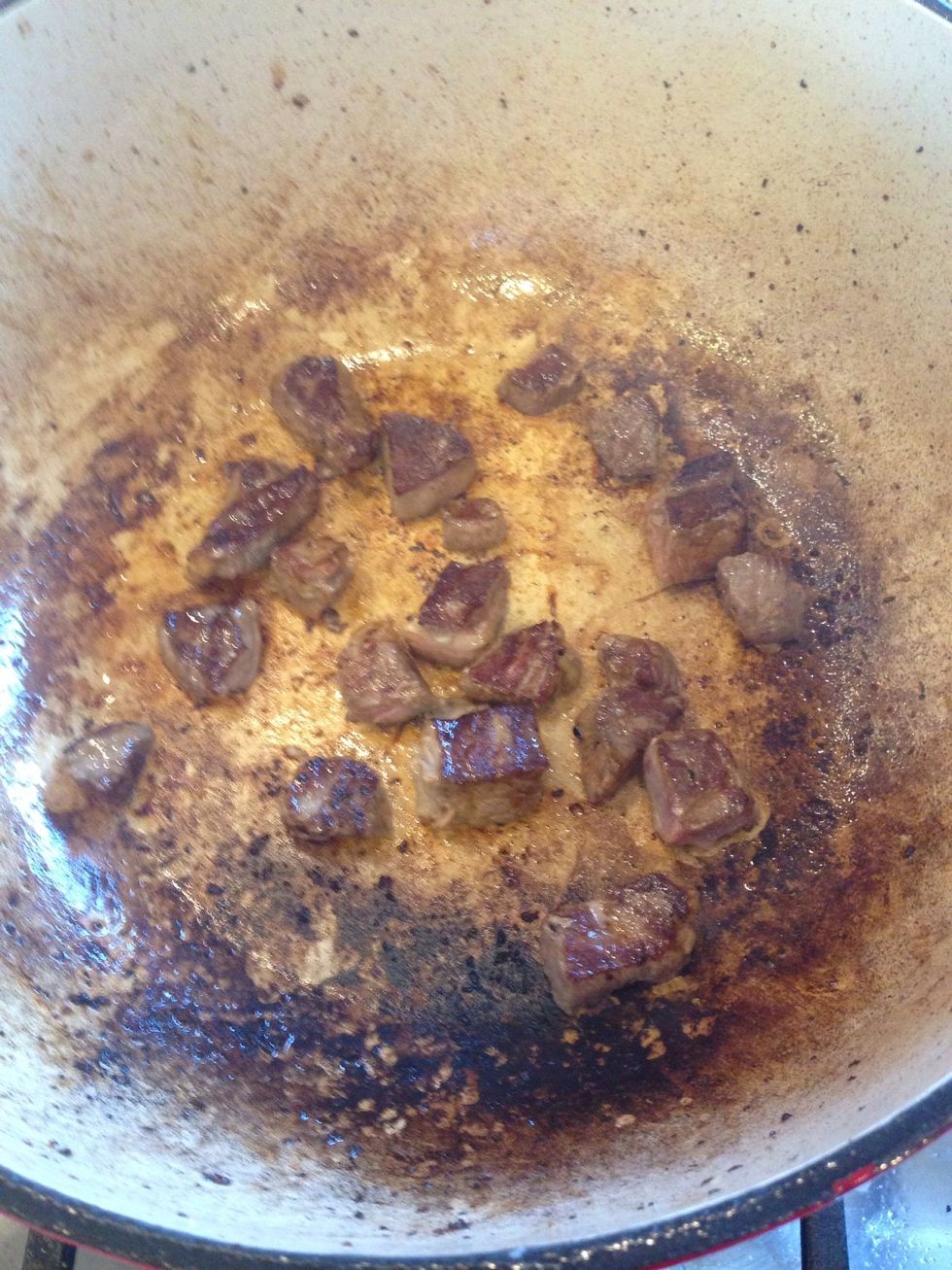 Brown all of your meat, in batches as to not over crowd the pot. Then set aside.