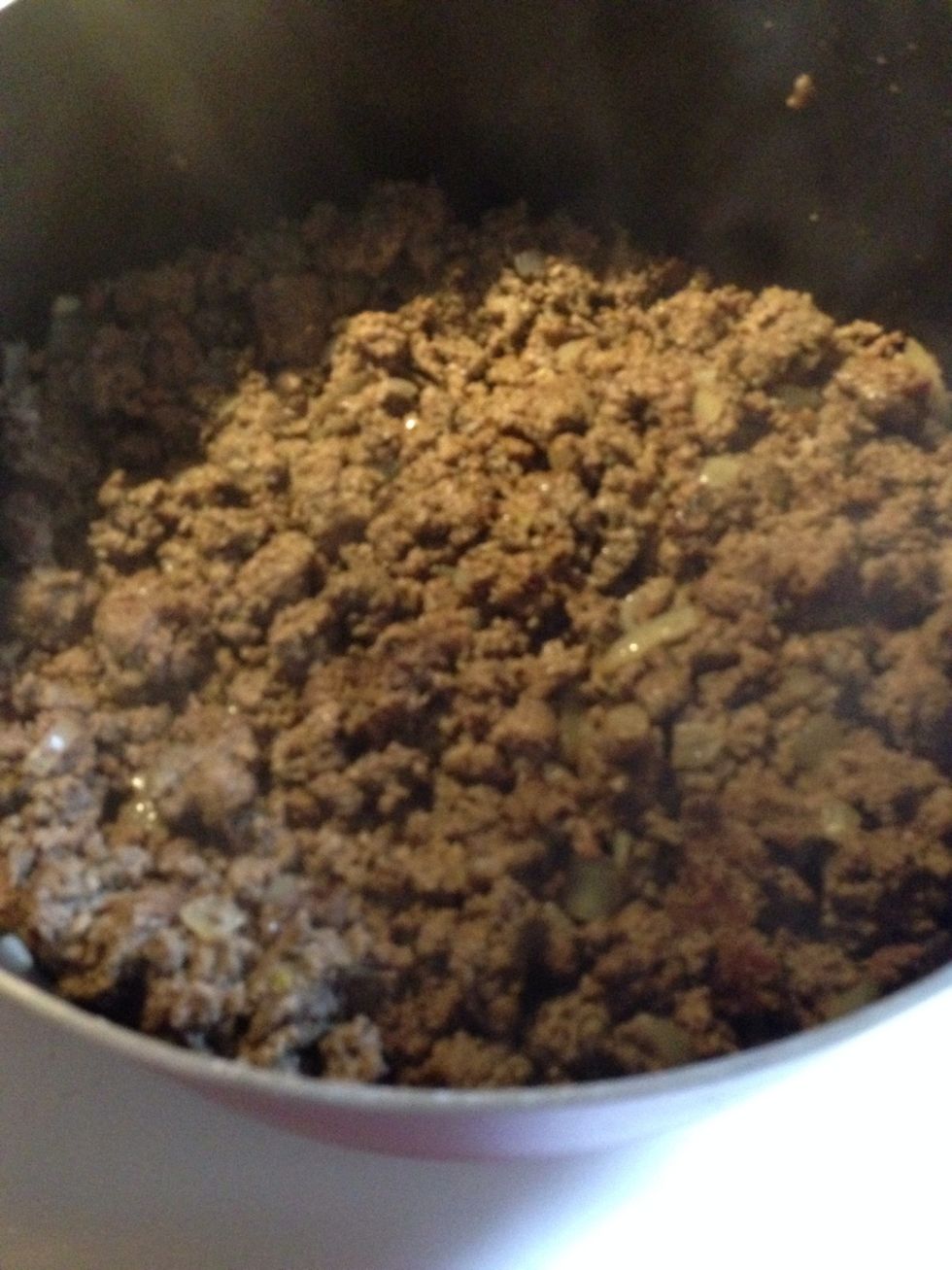 Brown beef and onion and drain any grease.. I use very lean ground beef so there is virtually no grease left over to drain...