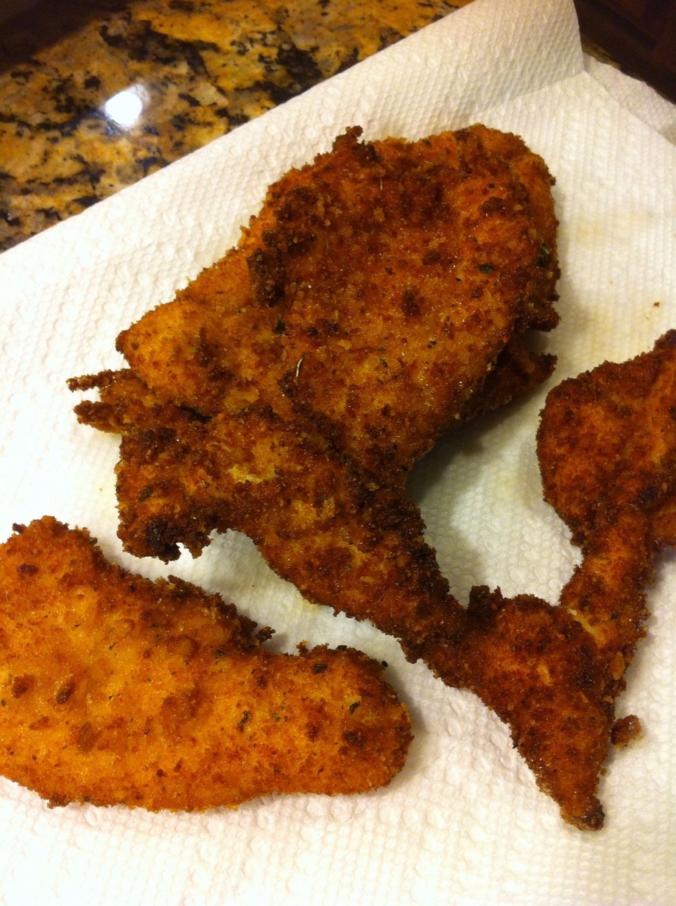 Brown chicken and drain on towel. If you pound chicken thin, it won't take but a minute or two to cook through. This chicken is perfect just like this! Very tasty and I use it often for chicken parm