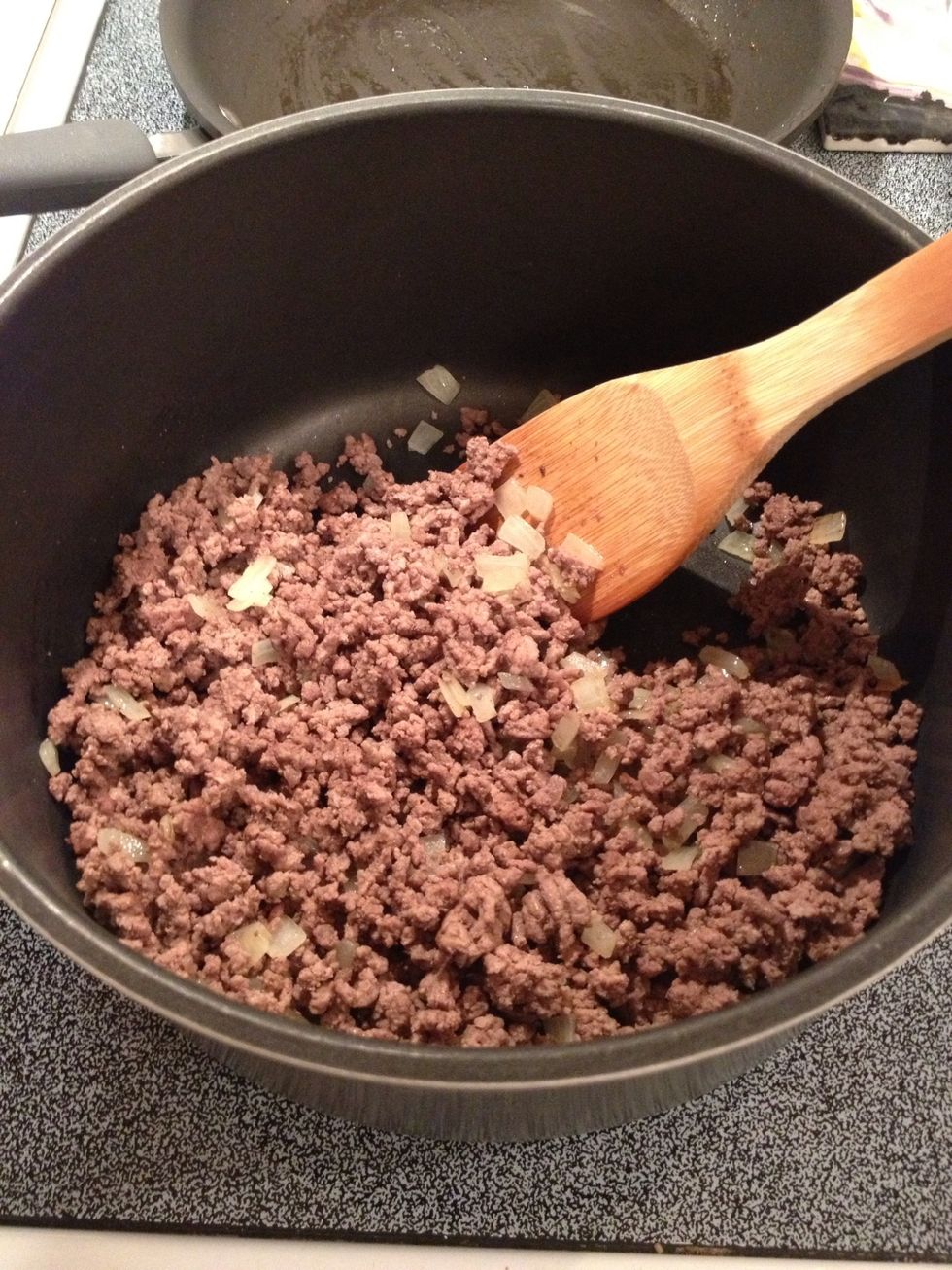 Brown ground beef.  Drain grease.  Add onions and mix well.