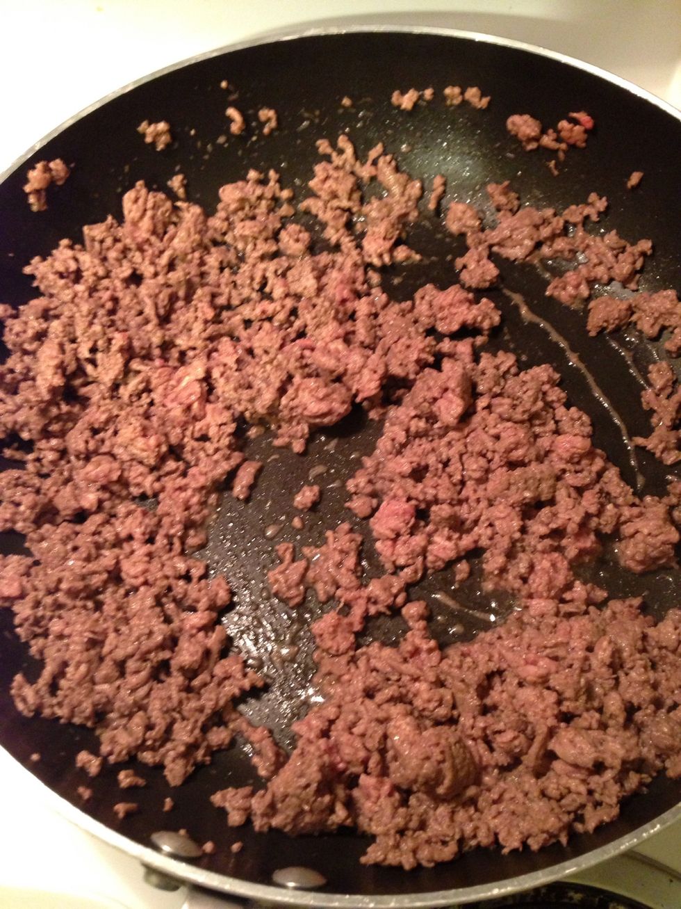 Brown ground beef. I also added some spices (pepper, garlic powder, cumin) and you can add veggies too like onion, peppers, garlic, etc.