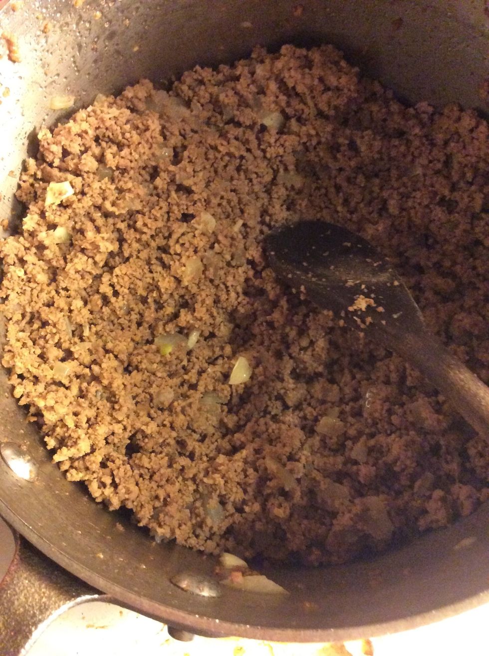 Brown meat with garlic and chopped onion in it