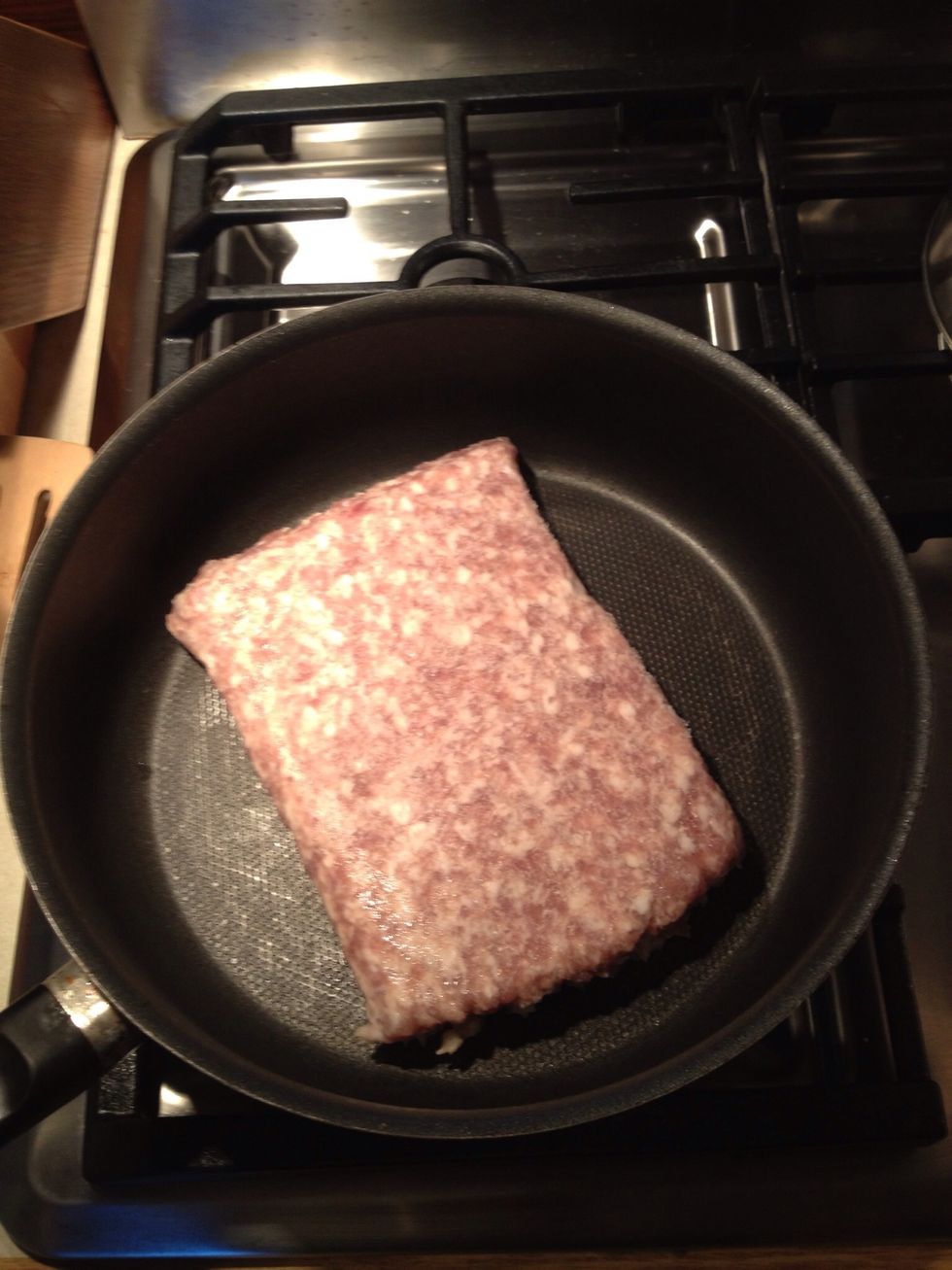 Brown sausage in large sauce pan