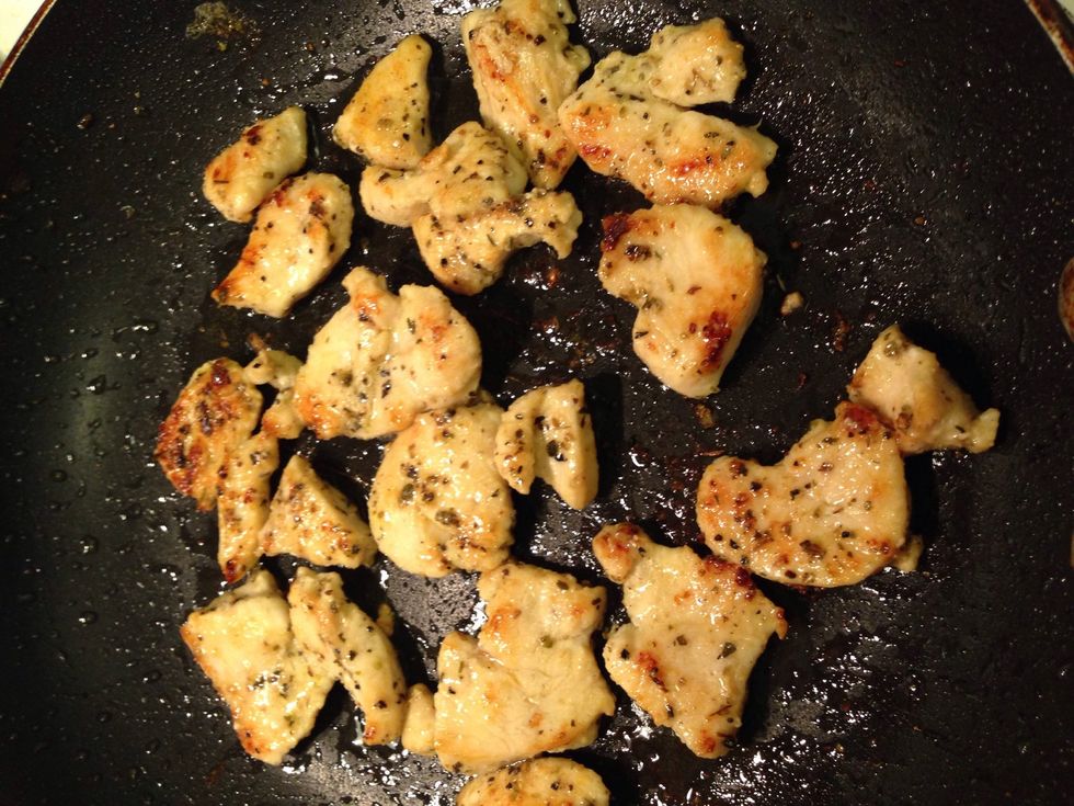 Brown the chicken in a pan (on med high heat) with enough olive oil to coat the bottom. Remove the cooked chicken & set aside. Deglaze the brown bits in the pan with the wine.