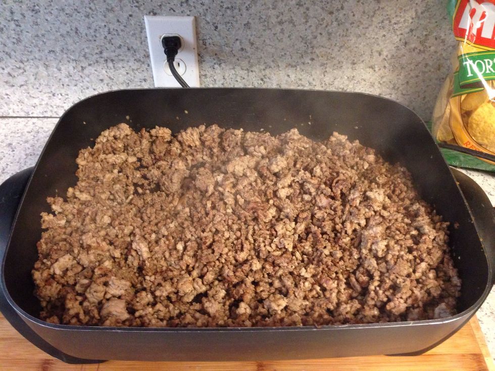 Brown the hamburger, pork and season with garlic or your favorite seasonings.