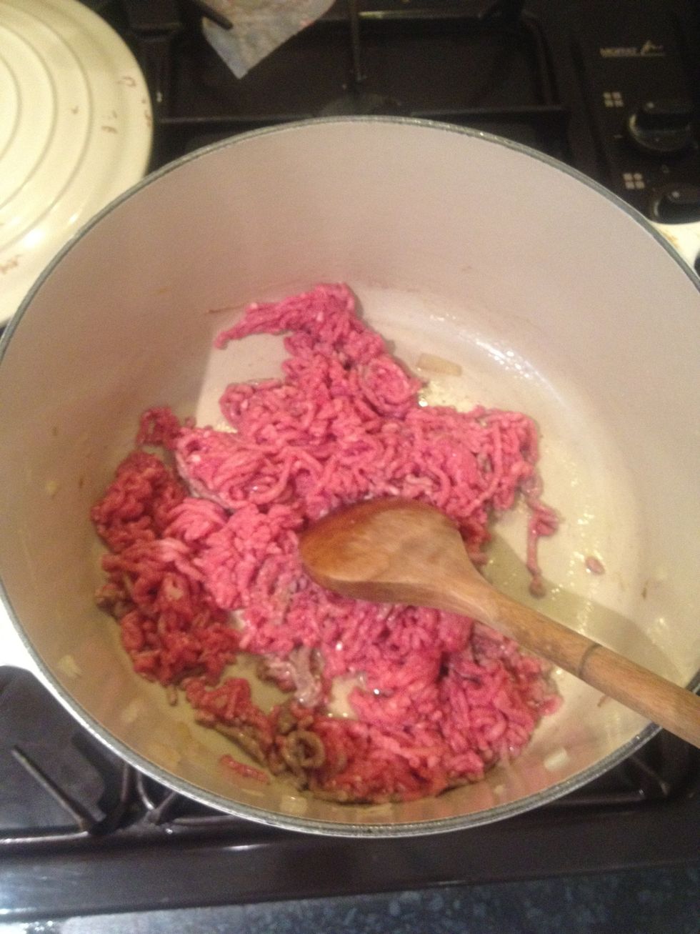 Brown the mince in the pan then drain excess fat