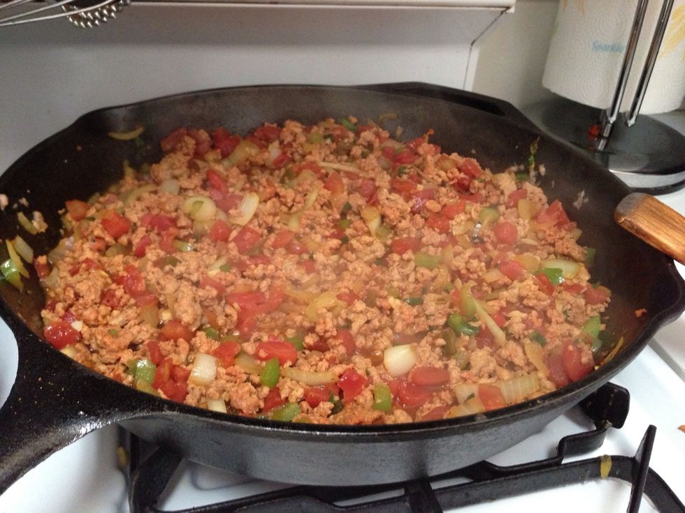 Brown the pork or beef in a large skillet with olive oil. Once the meat is a brown, throw in the garlic, chopped onion, and culantro. Then add the seasonings and diced tomato. Let cook until done.