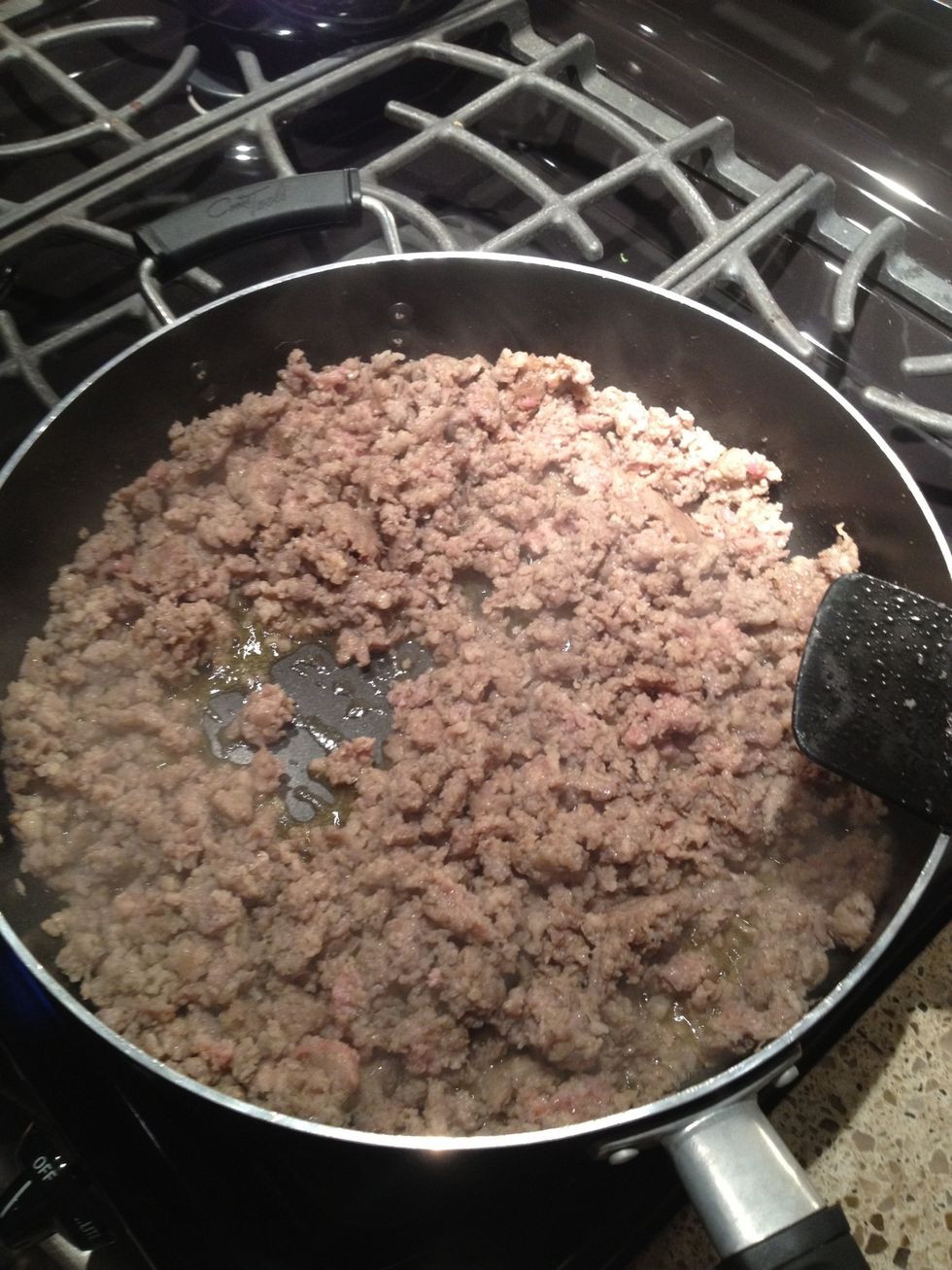 Brown the sausage in a skillet crumbling as you go.