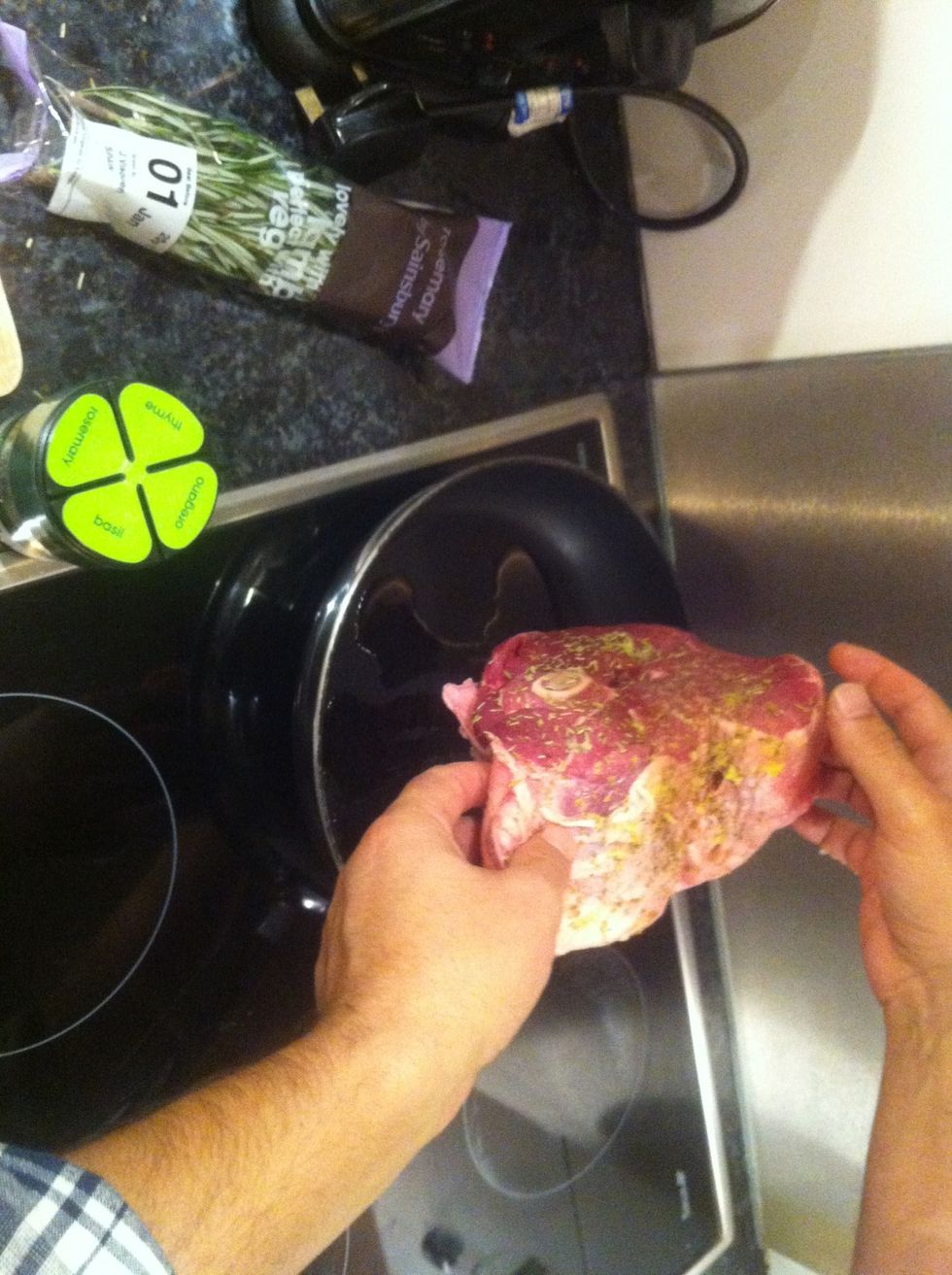 Brown the seasoned leg to seal the flavor - this step is optional