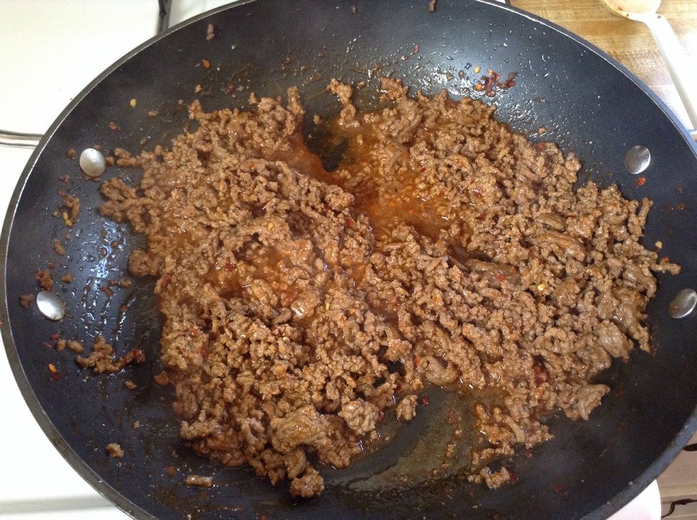 Brown your ground beef. Drain it. Then cook beef and taco seasoning as directed on back of the seasoning pack I like Ol paso hot and spicy but you can use whatever you want