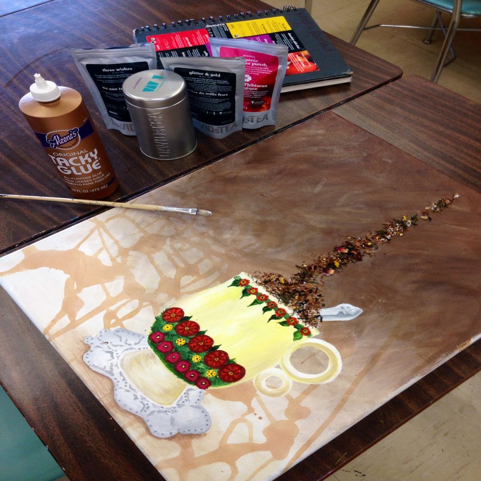 Brush a thin layer of white glue where steam would appear. Stick the tea leaves over the glue.  We used Davids Tea's 'Gingerbread', 'Hibiscus Punch', 'Glitter & Gold' and 'Three Wishes'. Allow to dry.