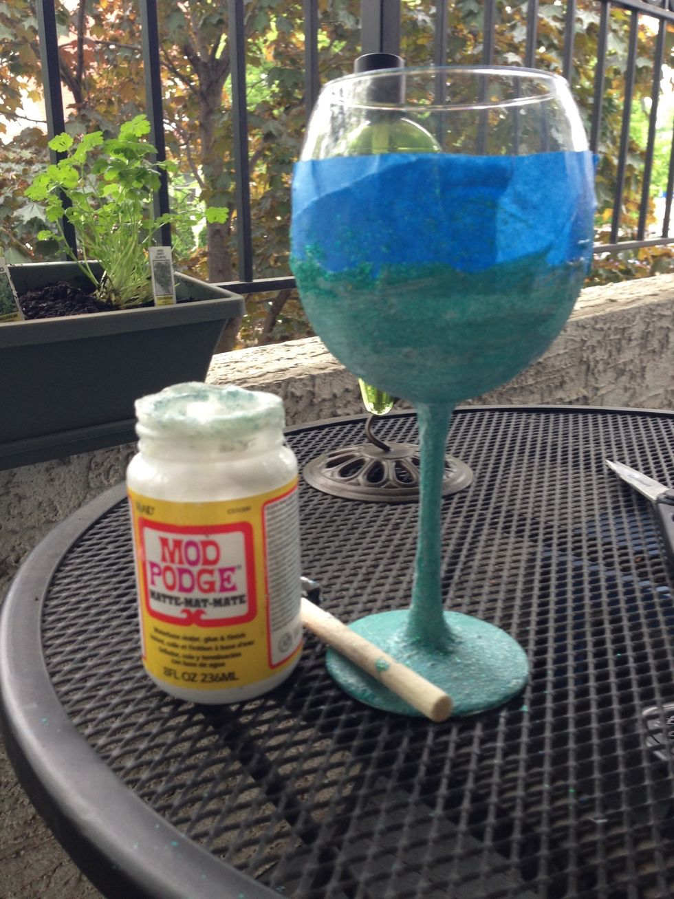 Brush another thin layer of mod podge on the glass and apply another coat of glitter. Let dry. Do this until you are satisfied with the look.