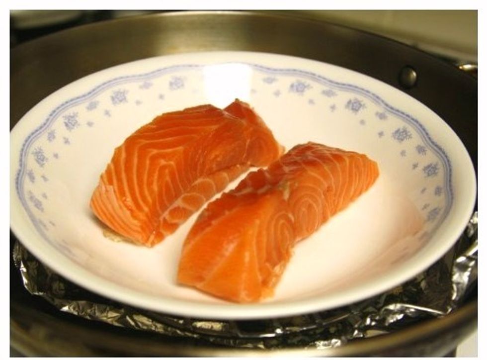 Brush both sides of fish with 2 tbsps oil and place in a heat-safe dish. Preheat pan over high heat until the tea mixture begins to smoke. Set the dish on top of a rack over the tea mixture.
