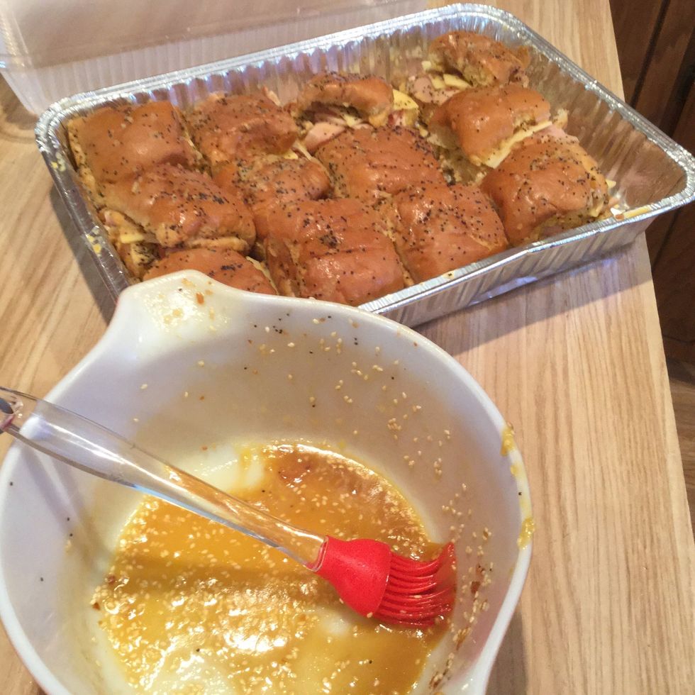 Brush butter mixture over each roll (on sides, tops, etc). Don't pour butter over them because it may cause them to become soggy.