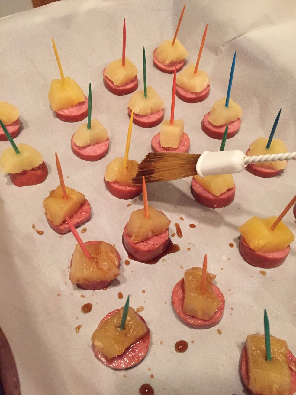 Brush each kielbasa bite with sauce, including top, sides, and bottom.
