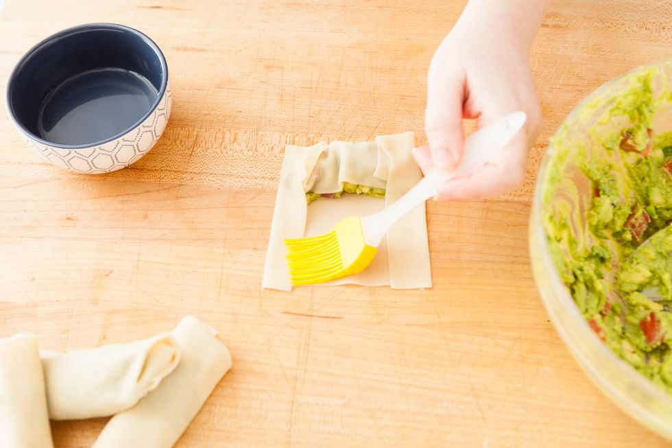 Brush edges with water and roll until sealed.
