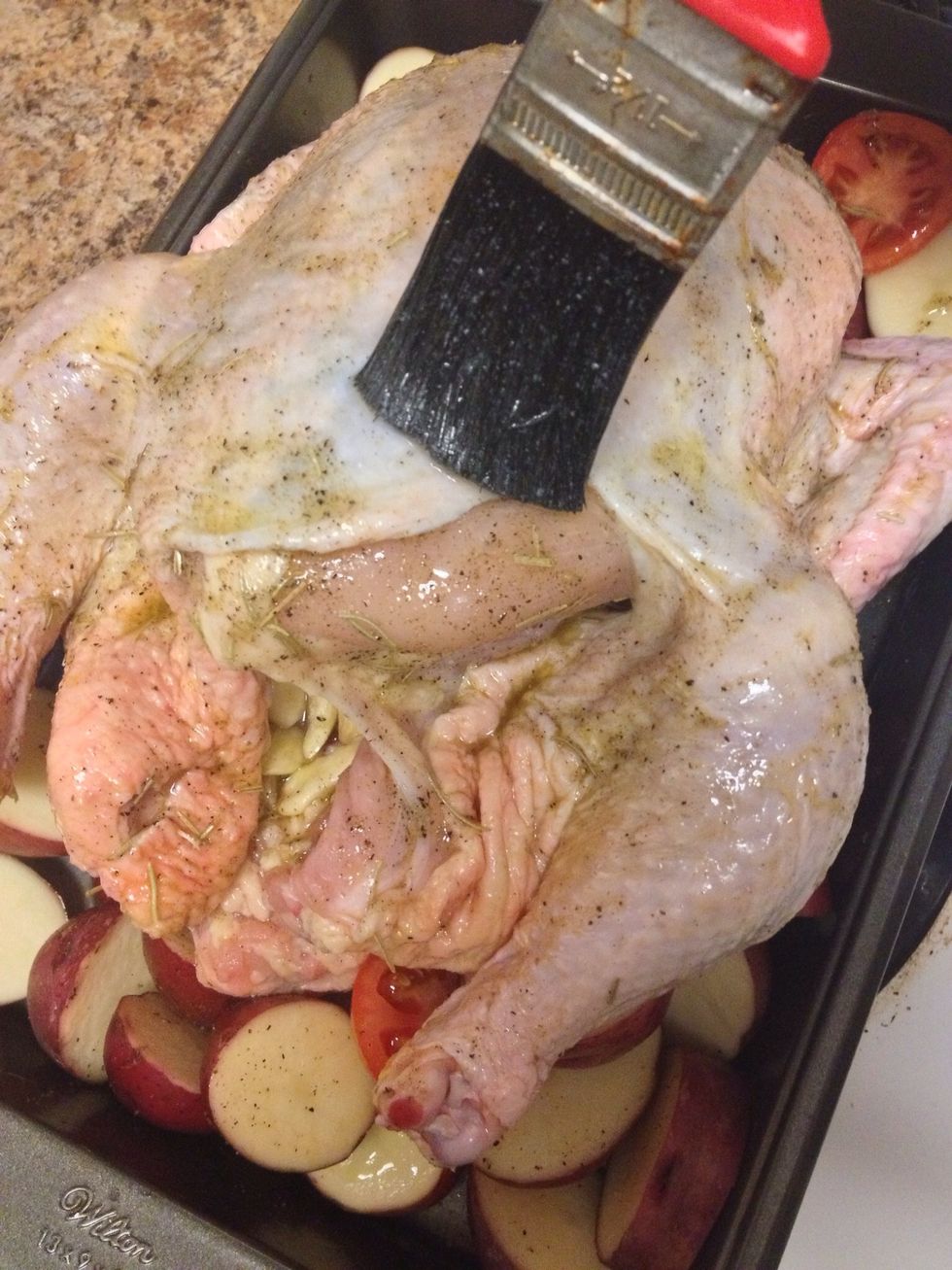 Brush melted butter all over the chicken.
