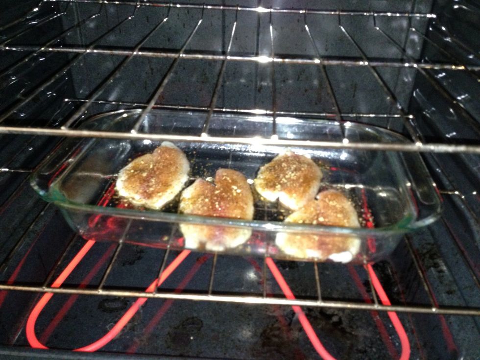 Brush olive oil over each tilapia fillet and apply all your seasonings. No need to turn fillet over. Place pan in pre-heated stove at 350 degrees and bake for 12-15 mins.
