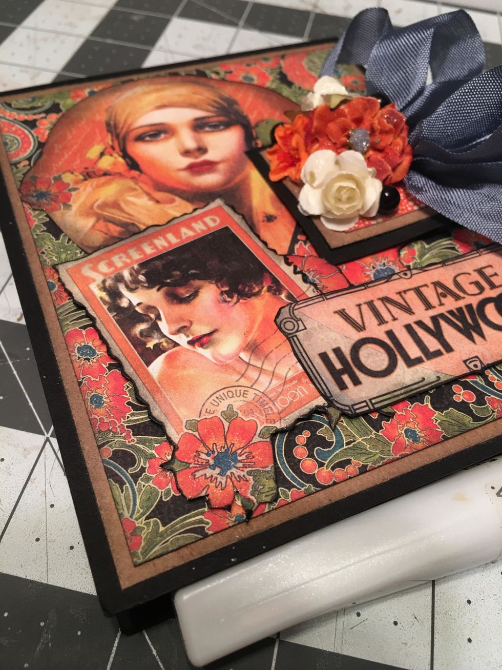 Brush on some clear Wink of Stella to some areas of the cover such as the cut out flowers, lips, edges for the stamp. You can also brush some onto the mini flowers if desired.