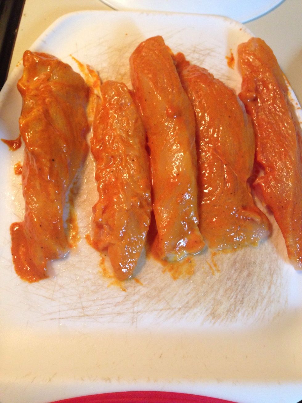 Brush on the marinade on the chicken.