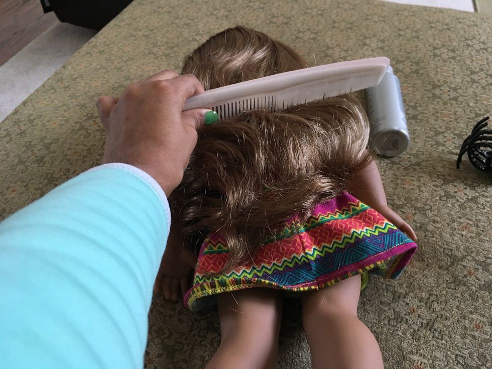 Brush out your doll\u2019s hair