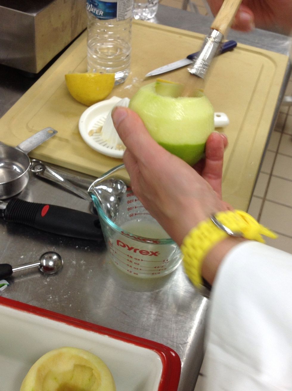 Brush outside of apples with the lemon juice.