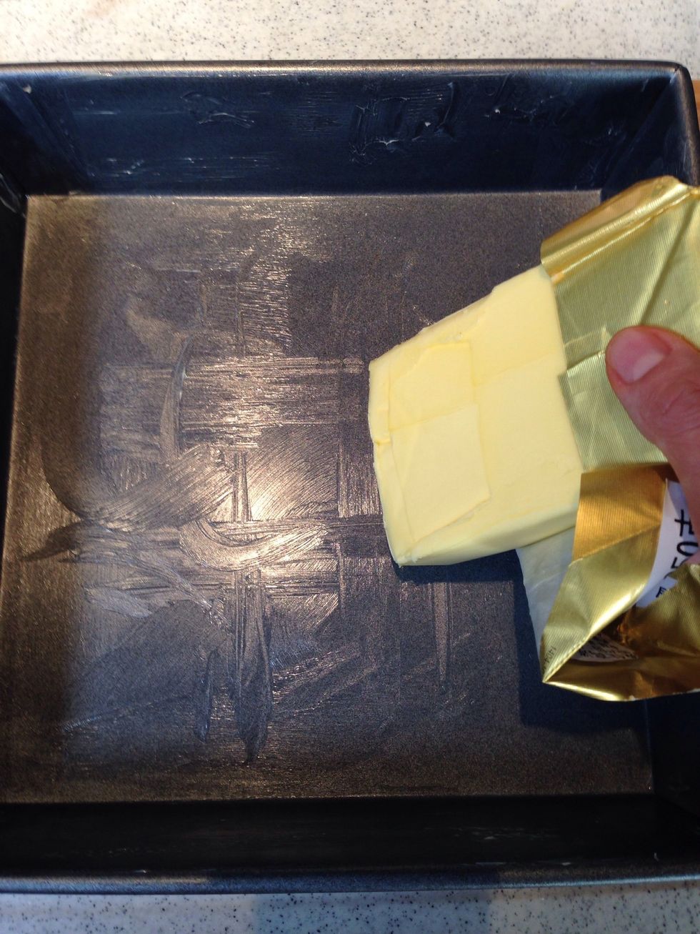 Brush/run butter over a 20cm square baking pan. I usually go with the lazy way of using the wrapped butter to grease the pan if it's a brand new butter