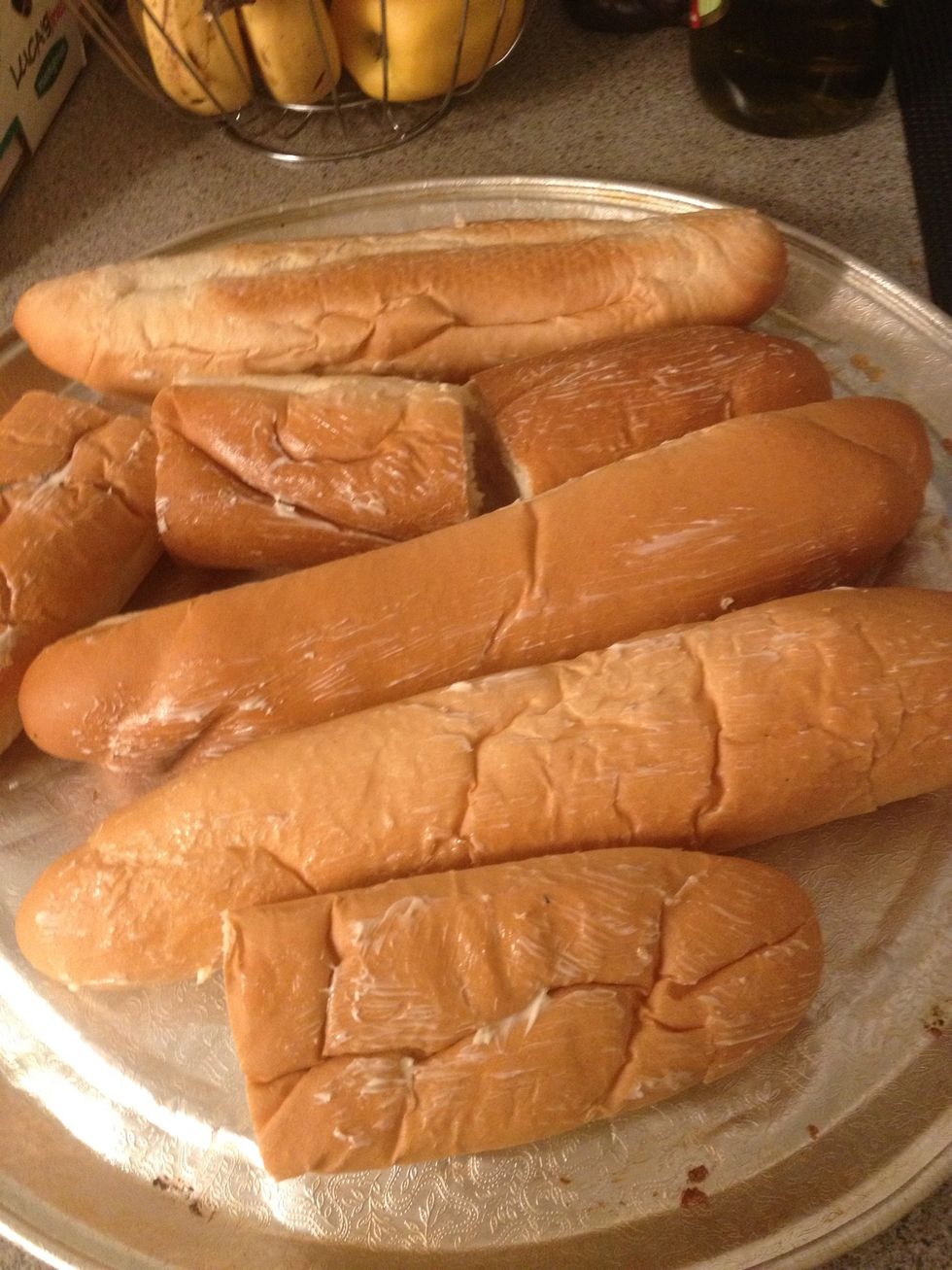 Brush some bread with garlic butter and heat them