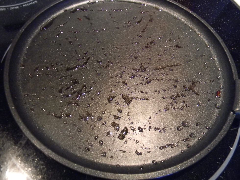 Brush some oil on the same pan you browned the meat and roasted the onions on and heat it to medium-high.