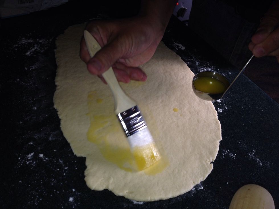 Brush the butter over the entire surface if the dough. For the vegan version spray the dough with light olive oil.