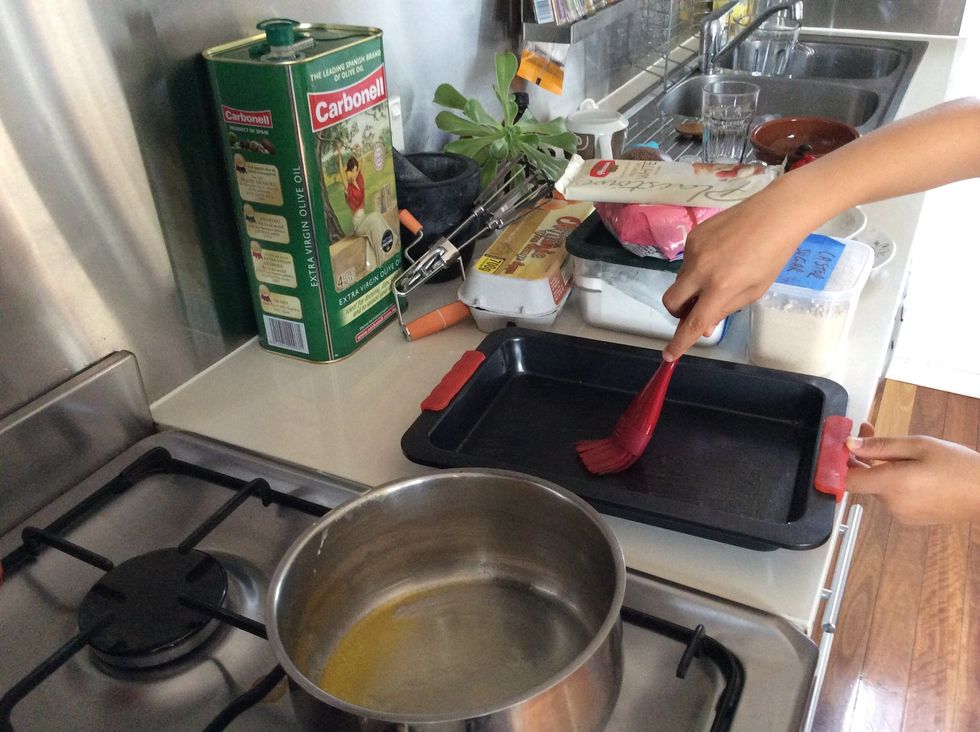 Brush the cake pan with butter