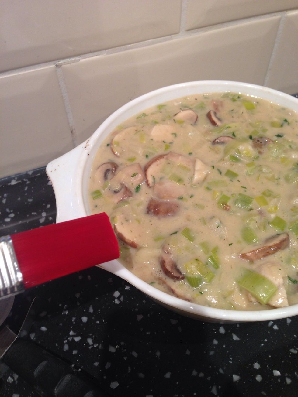 Brush the edges of the dish with water