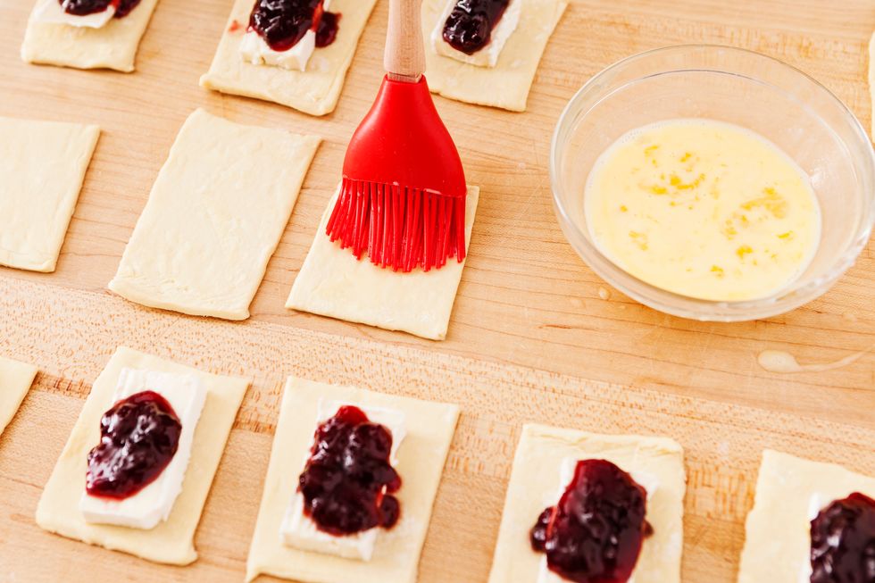 Brush the egg wash on 1/2 of the puff pastry rectangles.