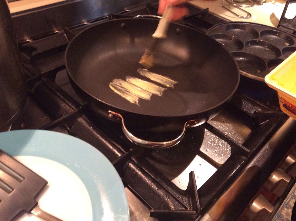 Brush the pan with butter.